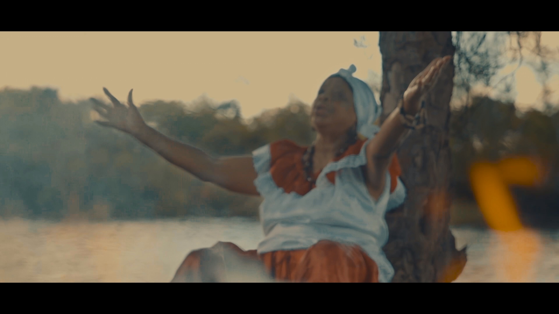 River scene with Julita for the clip Kote moun yo.